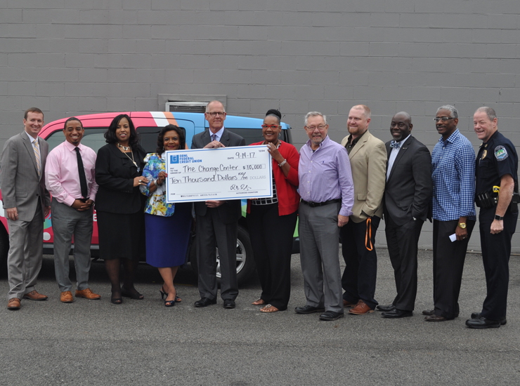 ORNL FCU staff presenting check to The Change Center