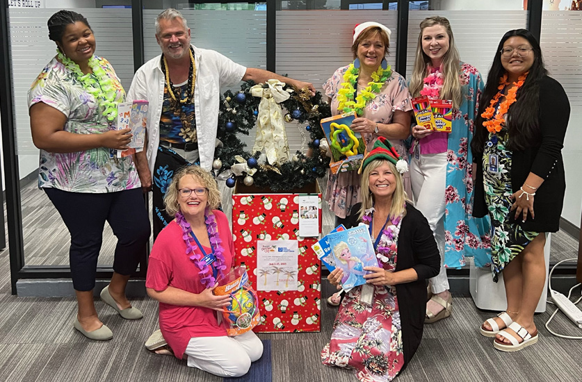 ORNL FCU staff in Christmas costumes