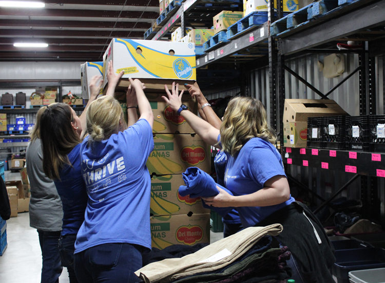 ORNL FCU volunteers stacking food boxes